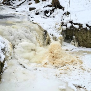 Frozen Ivande upper waterfall with ice and snow formations in winter Frozen Ivande upper waterfall with ice and snow formations in winter