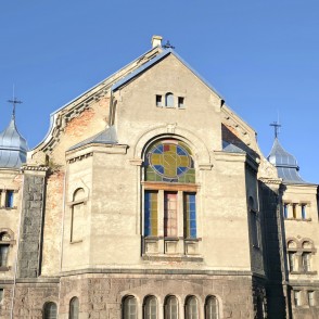 Liepaja Luther Church facade with a colorful circular stained glass Liepaja Luther Church facade with a colorful circular stained glass