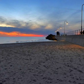 Sunset by Ventspils Southern Pier with illuminated promenade Sunset by Ventspils Southern Pier with illuminated promenade