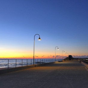 Sunset at Ventspils Southern Pier with illuminated promenade Sunset at Ventspils Southern Pier with illuminated promenade