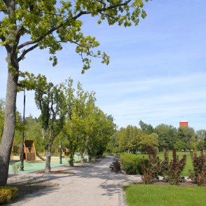 Park pathway in Kemeri resort park with playground Park pathway in Kemeri resort park with playground