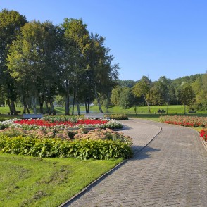 Blooming flower beds and curved pathway in a Skuodas city park Blooming flower beds and curved pathway in a Skuodas city park