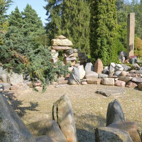 Stone garden courtyard with boulder wall and sculptural composition Stone garden courtyard with boulder wall and sculptural composition