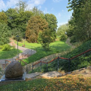 Stairway path with sculpture and wide green valley in Salantai City Park Stairway path with sculpture and wide green valley in Salantai City Park