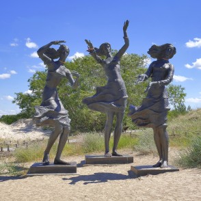 Fisherman Daughters sculpture in Sventoji sand dunes Fisherman Daughters sculpture in Sventoji sand dunes